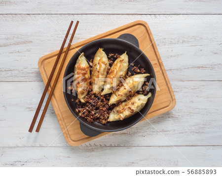 Fried Asian dumplings in bowl Fried Asian dumplings in bowl 56885893