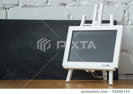 Close-up of a miniature chalk board on the Close-up of a miniature chalk board on the 56886143