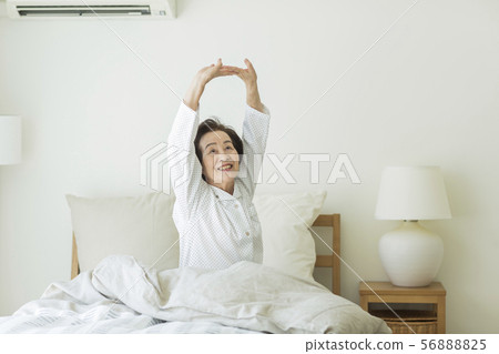 Senior woman waking up Senior woman waking up 56888825