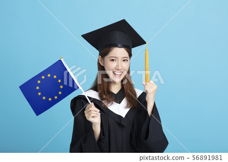 happy Young female graduation student showing the 56891981