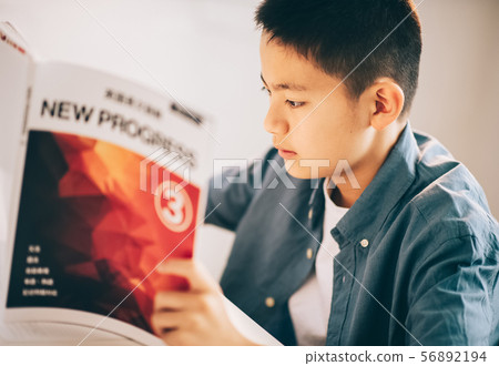 Boy studying English Boy studying English 56892194