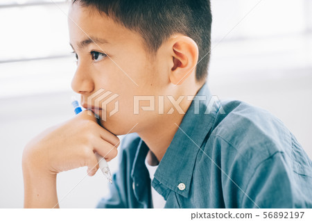 Boy elementary school student study 56892197