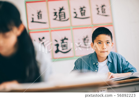 Boy elementary school student study 56892223