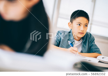 Boy elementary school student study 56892332