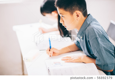 Boy elementary school student study 56892379