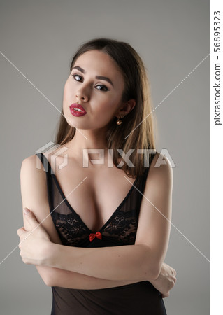 Portrait of sensual dark-haired model in peignoir Portrait of sensual dark-haired model in peignoir 56895323