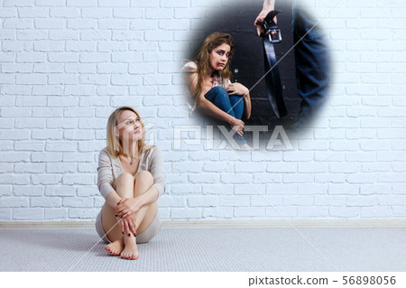Young woman looking on imaginary scene of beaten woman. Young woman looking on imaginary scene of beaten woman. 56898056