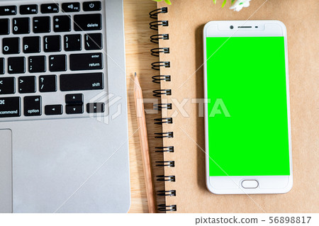 laptop with smartphone on notebook,a pencil and laptop with smartphone on notebook,a pencil and 56898817