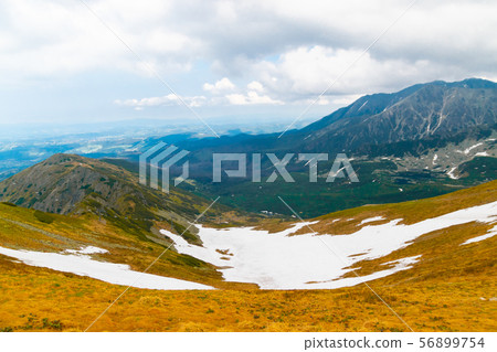 Beautiful panorama of green mountains hills with snow from Kars to Kasprowy Wierch in summer. Beautiful panorama of green mountains hills with snow from Kars to Kasprowy Wierch in summer. 56899754