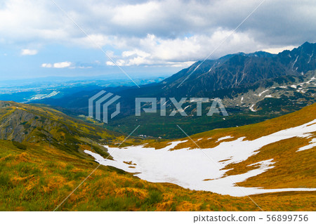 Beautiful panorama of green mountains hills with snow from Kars to Kasprowy Wierch in summer. 56899756