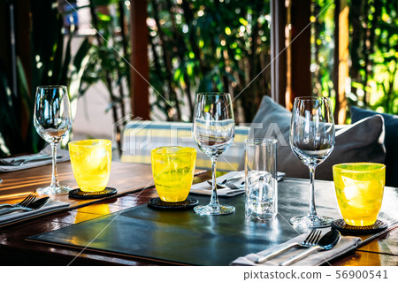 Wine glass with dining set prepare for breakfast lunch or dinner on table in restaurant 56900541
