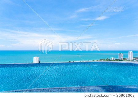 Beautiful outdoor landscape of infinity swimming pool in hotel resort 56901002