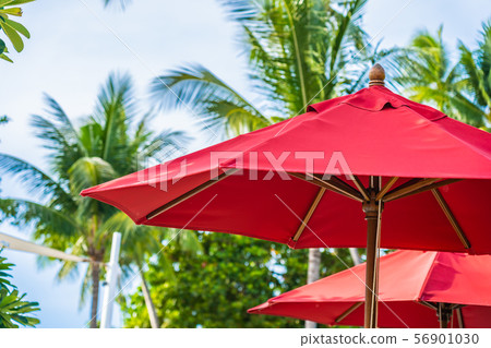 Beautiful umbrella and chair around outdoor swimming pool in hotel resort for holiday vacation travel 56901030
