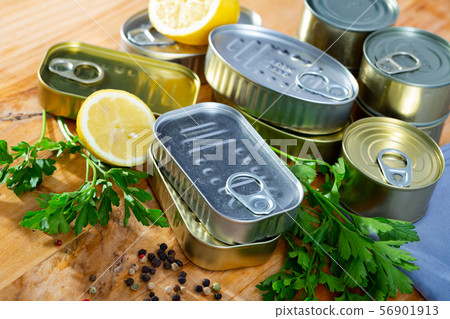 Unlabeled tin cans on table Unlabeled tin cans on table 56901913