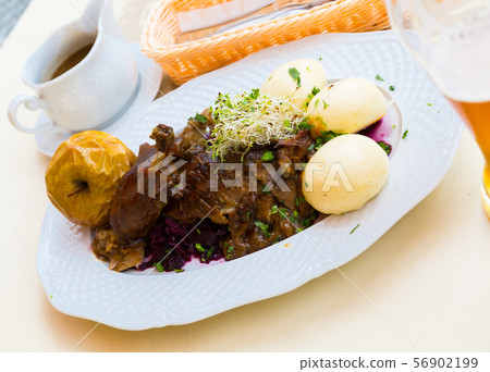 Duck with yeast dumplings and blue cabbage 56902199