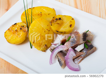 Pickled herring with pieces of potatoes Pickled herring with pieces of potatoes 56902270