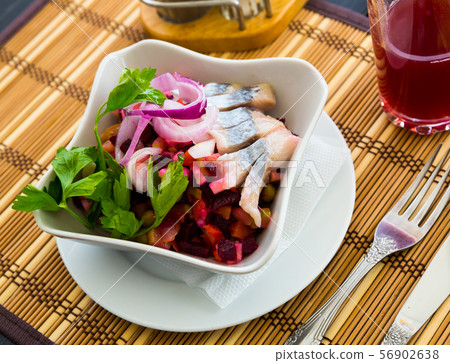 Fresh salad vinaigrette on a bamboo napkin. Russian dish Fresh salad vinaigrette on a bamboo napkin. Russian dish 56902638