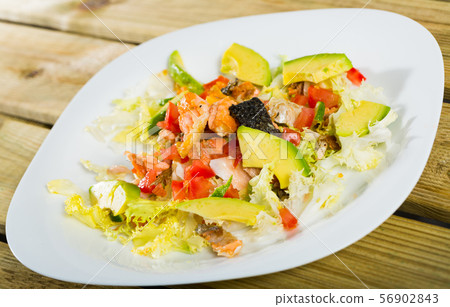 Salad of grilled salmon, avocado, lettuce, tomatoes Salad of grilled salmon, avocado, lettuce, tomatoes 56902843