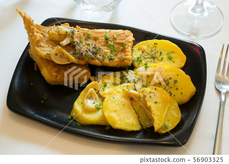 Roasted ray wings with potatoes Roasted ray wings with potatoes 56903325