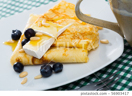 Crepes with brie and honey 56903417
