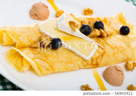 Brie cheese on top of pancakes Brie cheese on top of pancakes 56903421