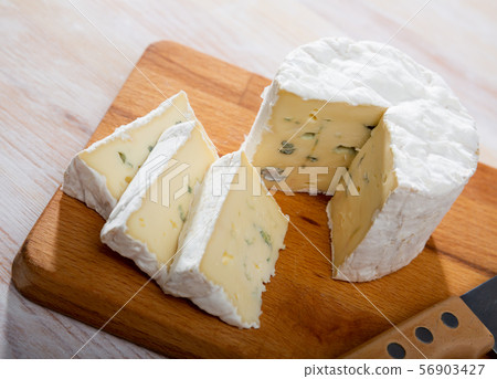 Blue cheese on wooden board 56903427