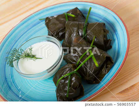 Grape rolls made from grape leaves and sour cream, dish of Bulgarian cuisine 56903557