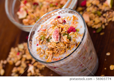 Glass of milk with muesli Glass of milk with muesli 56903774