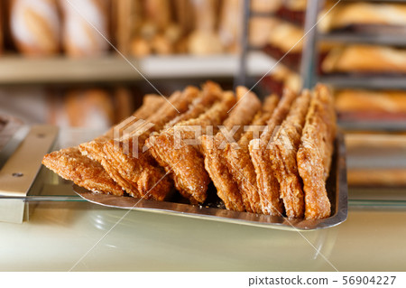 Tray with sweet pastry on bakery showcase Tray with sweet pastry on bakery showcase 56904227