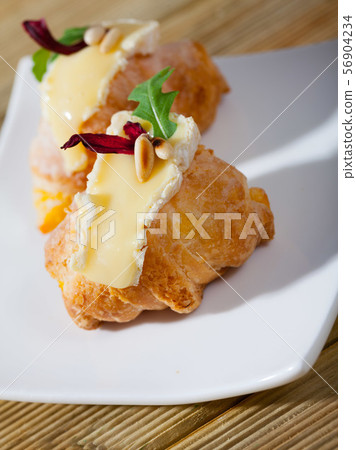 Mini croissant with Camembert, arugula Mini croissant with Camembert, arugula 56904234