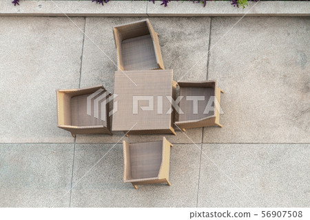 Four seaters outdoor patio set on a washed sand Four seaters outdoor patio set on a washed sand 56907508