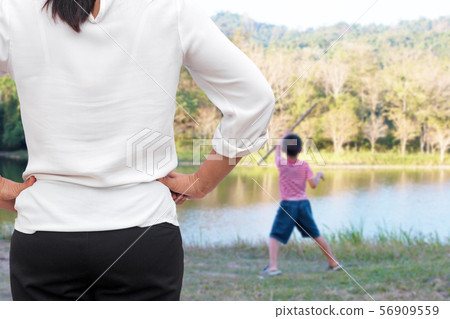 Mother scolds her child because of playing naughty Mother scolds her child because of playing naughty 56909559