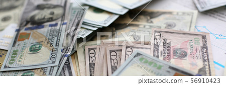 Big pile of US money lying down in random order 56910423