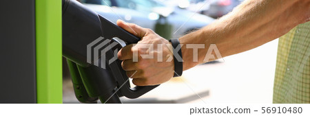 Male hand hold pistol an electric charge 56910480