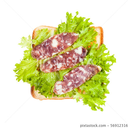 open sandwich with toast, sausage and leaf lettuce open sandwich with toast, sausage and leaf lettuce 56912316