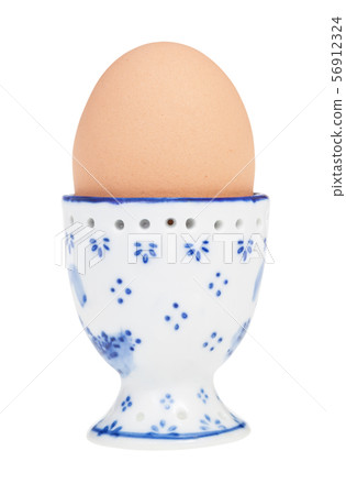 brown boiled egg in cup with a pointy end up brown boiled egg in cup with a pointy end up 56912324
