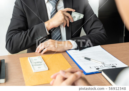 Bribery and corruption, Businessman hand giving 56912348
