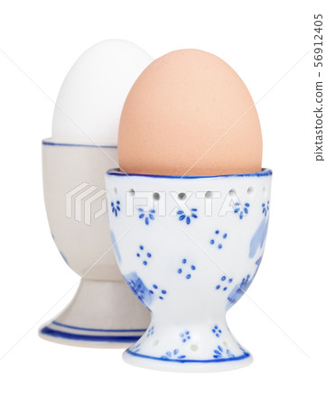 side view of brown and white boiled eggs in cups 56912405