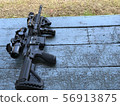 Assault rifle placed on the table 56913875