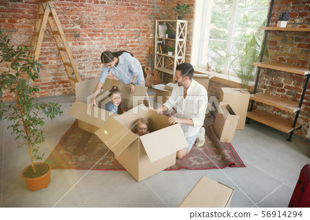 Adult family moved to a new house or apartment Adult family moved to a new house or apartment 56914294
