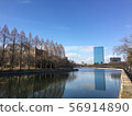 Building and blue sky reflected on the surface of the moat 56914890