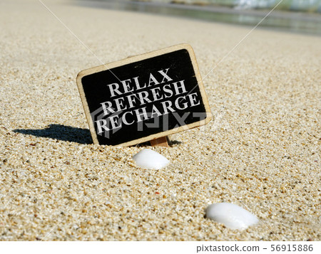 Relax refresh recharge sign on a beach. Relax refresh recharge sign on a beach. 56915886