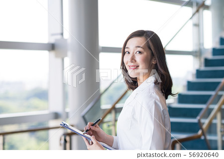 Young woman with lab coat Young woman with lab coat 56920640