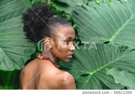 Half-turned african girl with bare shoulders with 56921269