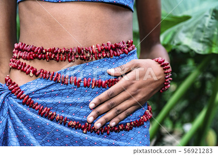 Young african girl's body in blue skirt outdoor 56921283