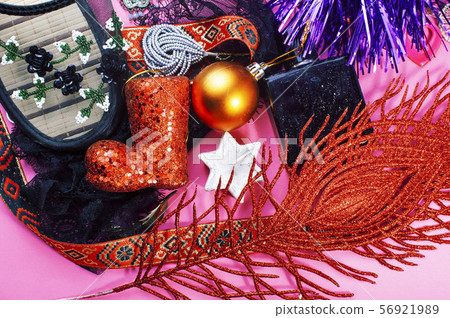 new year party stuff close up in mess on bright pink background, holiday gifts concept 56921989