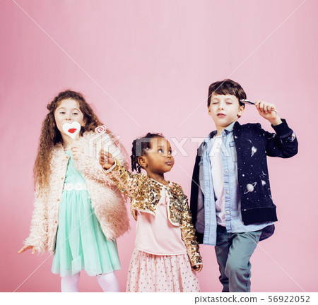 lifestyle people concept: diverse nation children playing together, boy and girl, caucasian and lifestyle people concept: diverse nation children playing together, boy and girl, caucasian and 56922052