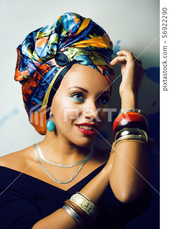 beauty bright african woman with creative make up, shawl on head like cubian closeup smiling beauty bright african woman with creative make up, shawl on head like cubian closeup smiling 56922290