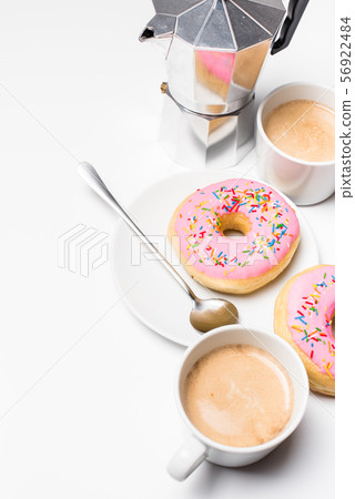 Fresh hot coffe and pink sweet donut on white background isolated 56922484