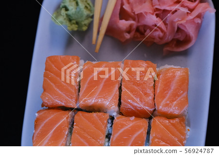 Sushi roll with seafood and soy sauce, wasabi and Sushi roll with seafood and soy sauce, wasabi and 56924787